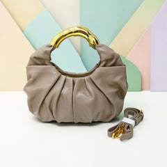 THE GOLD HANDLE CLOUD BAG