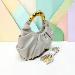 THE GOLD HANDLE CLOUD BAG