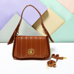 THE PLEATED TURN-LOCK SLING