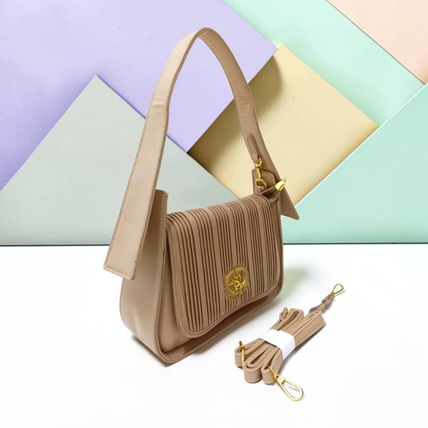THE PLEATED TURN-LOCK SLING