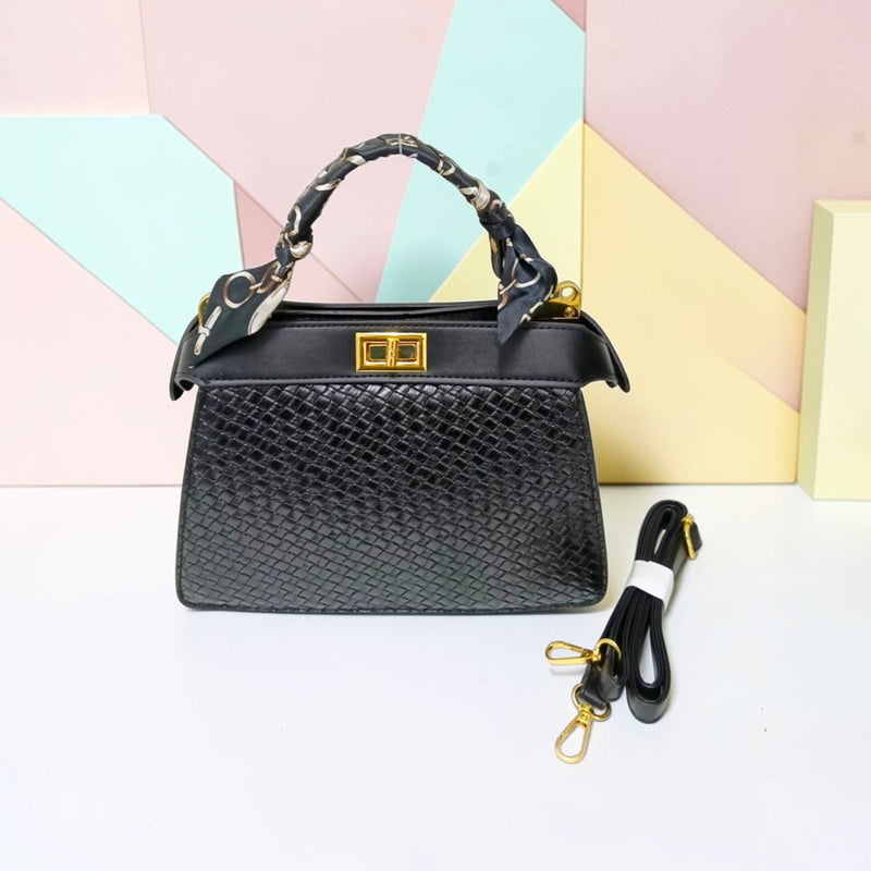 TRAPEZOID TURN-LOCK HANDBAG