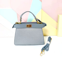 TRAPEZOID TURN-LOCK HANDBAG