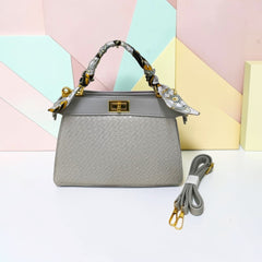 TRAPEZOID TURN-LOCK HANDBAG