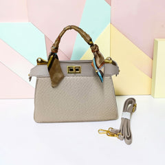 TRAPEZOID TURN-LOCK HANDBAG