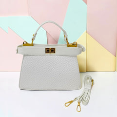 TRAPEZOID TURN-LOCK HANDBAG